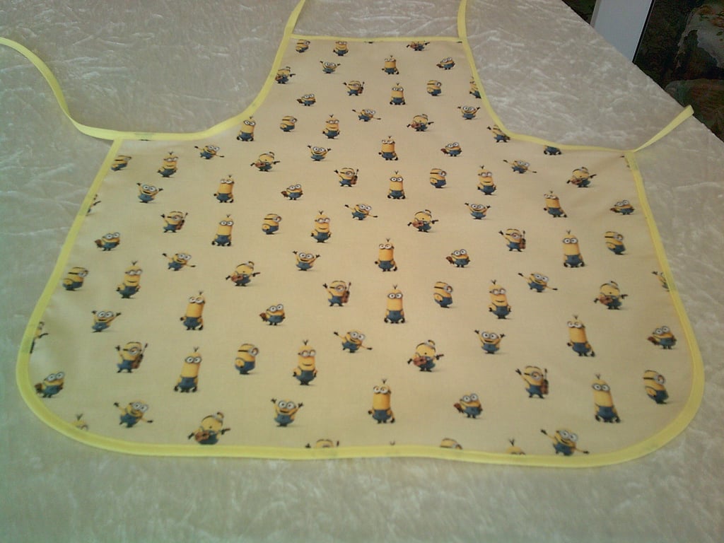 Baby Apron with Minions on Pale Yellow