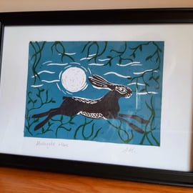 Original linoprint of a hare running through woodland under a moonlit sky