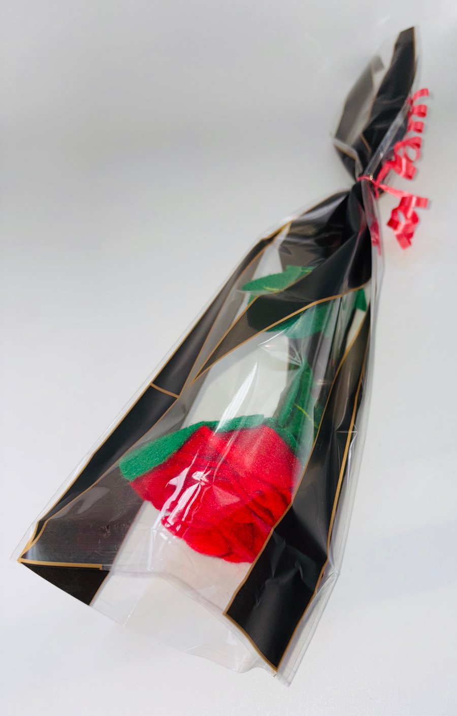 Long steamed felt red rose