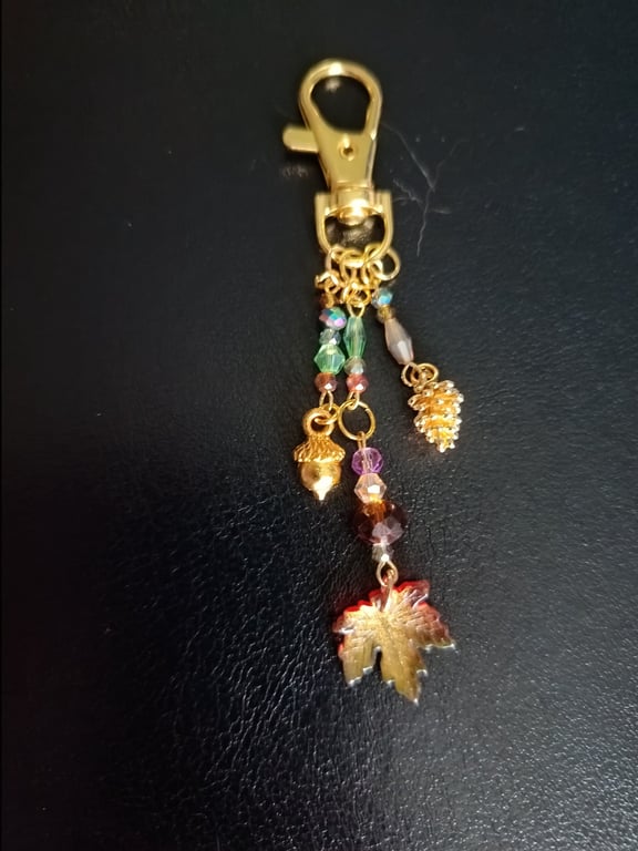Gold autumnal beaded bag charm with leaf, acorn and pine cone charms 