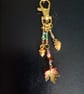 Gold autumnal beaded bag charm with leaf, acorn and pine cone charms 