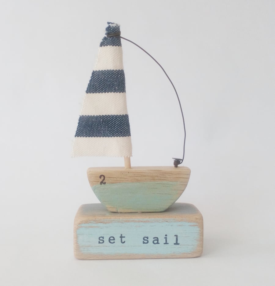 Handmade little wooden sail boat