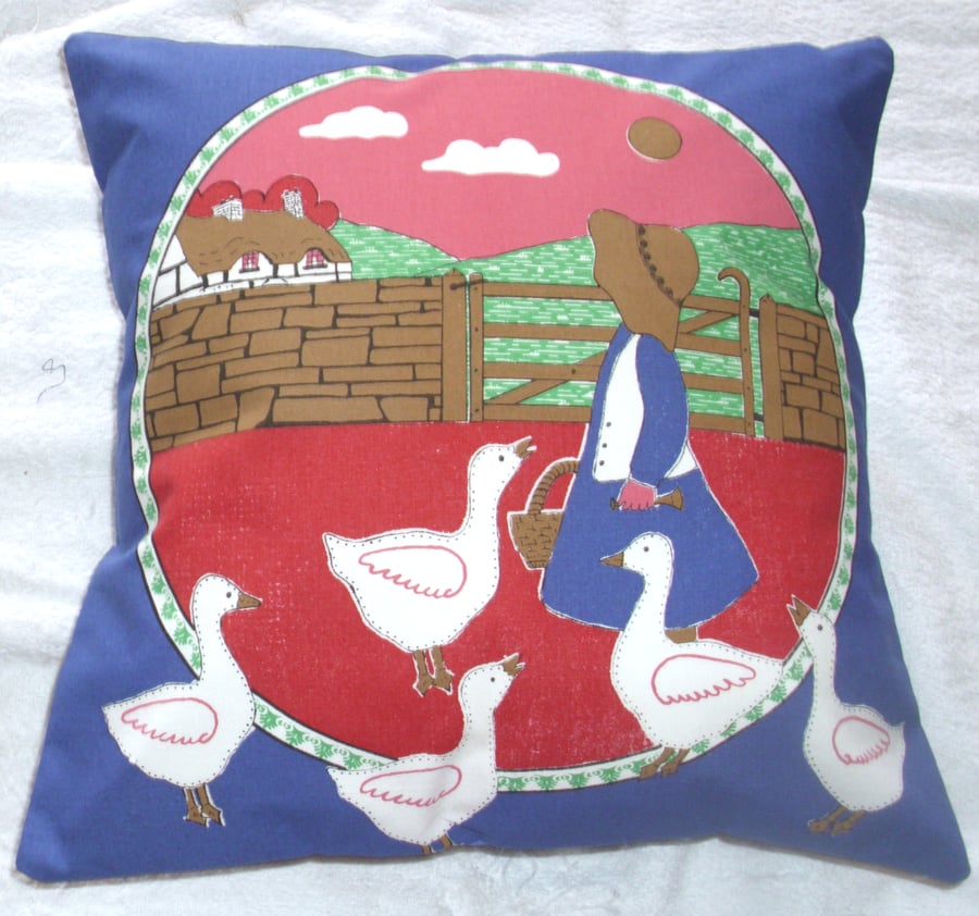 Little Goosegirl with her geese cushion