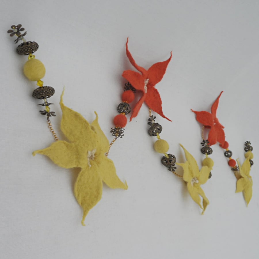 Five flower felted garland, yellow and orange
