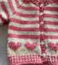 Baby’s pink and cream striped cardigan with heart motifs - Image 4