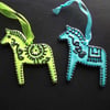 Set of  two ceramic folk horse decorations