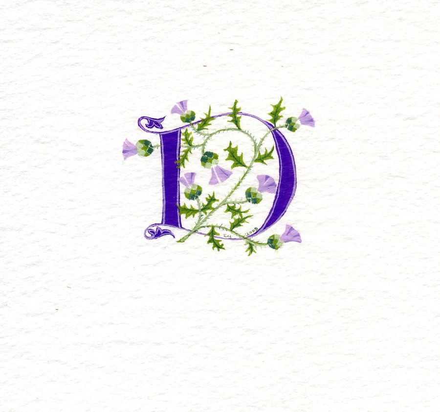 Custom letter  in purple with thistles .