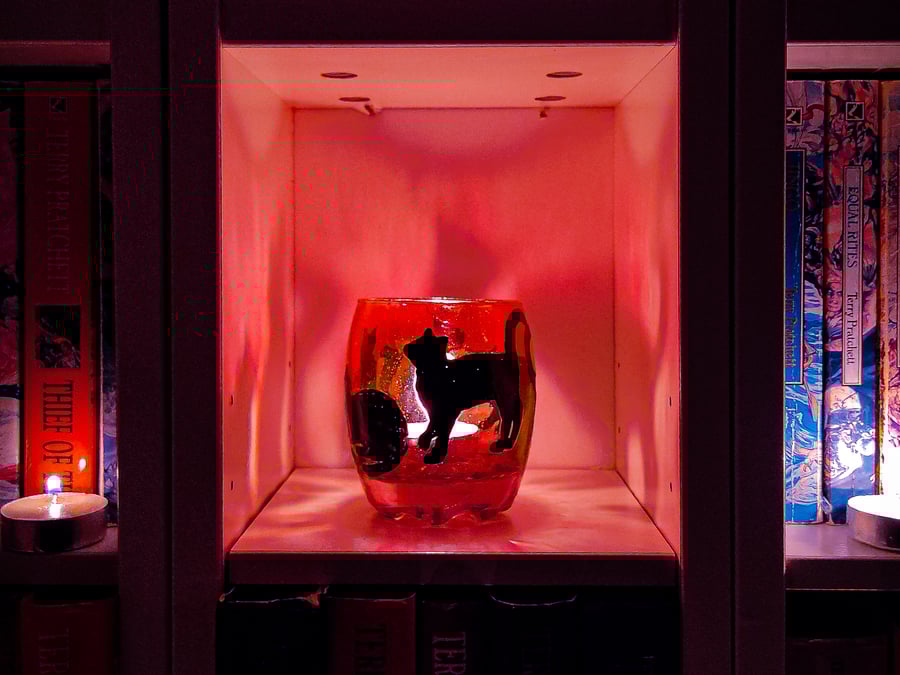 Glass painted purple candle holder with black silhouettes of cats