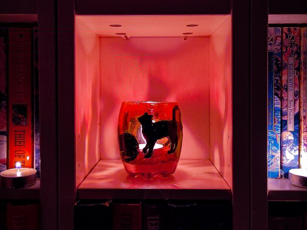 Glass painted purple candle holder with black silhouettes of cats