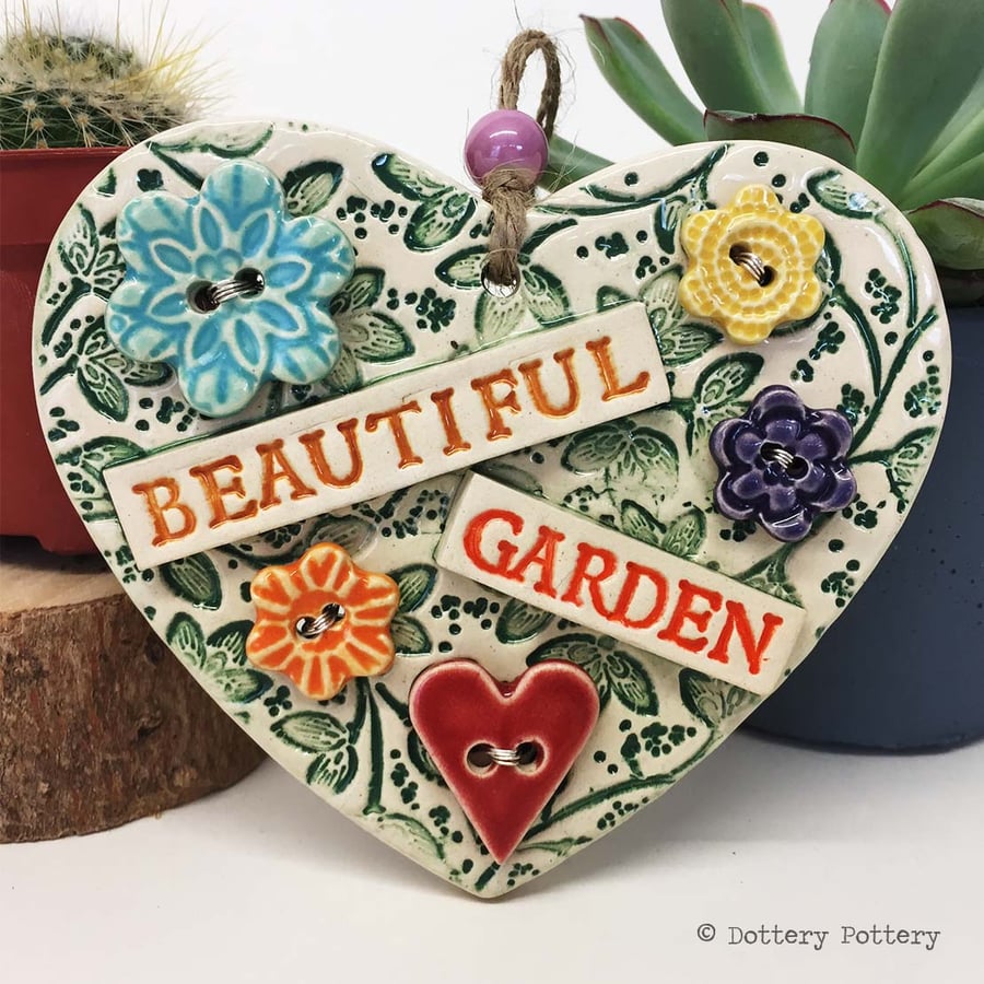 Ceramic heart decoration with button flowers Beautiful garden 