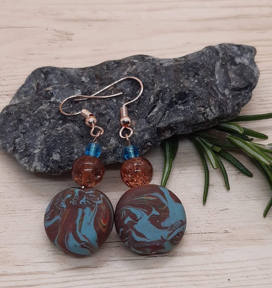 Disc shaped dangly earrings