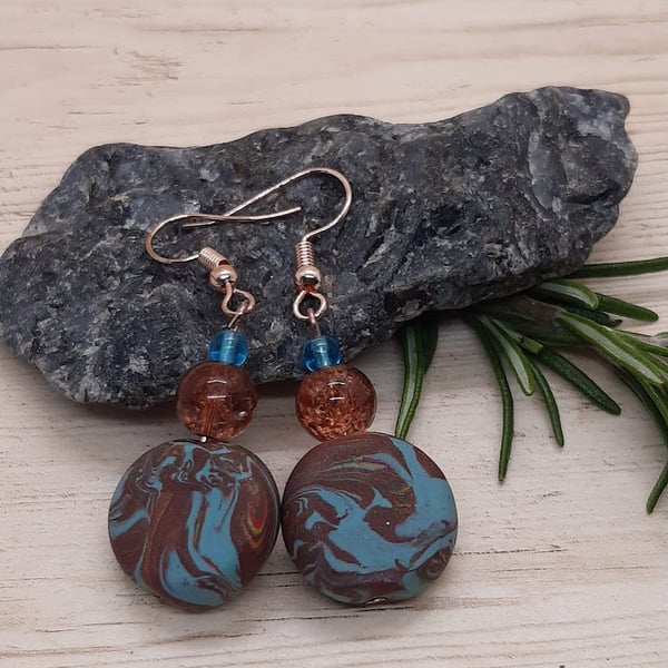Disc shaped dangly earrings