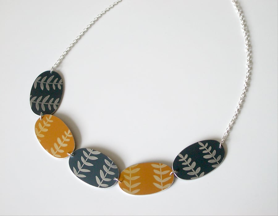 Leaf necklace in orange yellow and grey