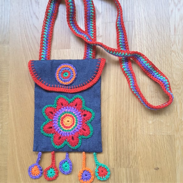 Small denim phone bag, coin bag, sanitizer bag, decorated with crochet motifs.