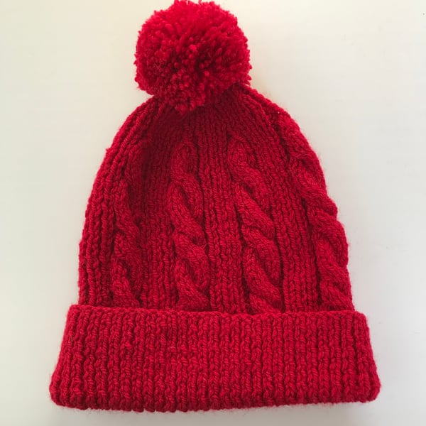Hand knitted child's red winter hat cable with pompom age 3 - 6 years approx