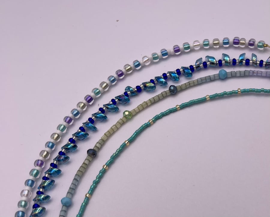 Set of four stacking bracelets