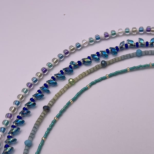 Set of four stacking bracelets