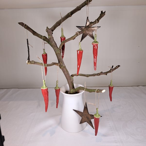 Christmas tree decorations. A set of five - hand made glazed ceramic chillies