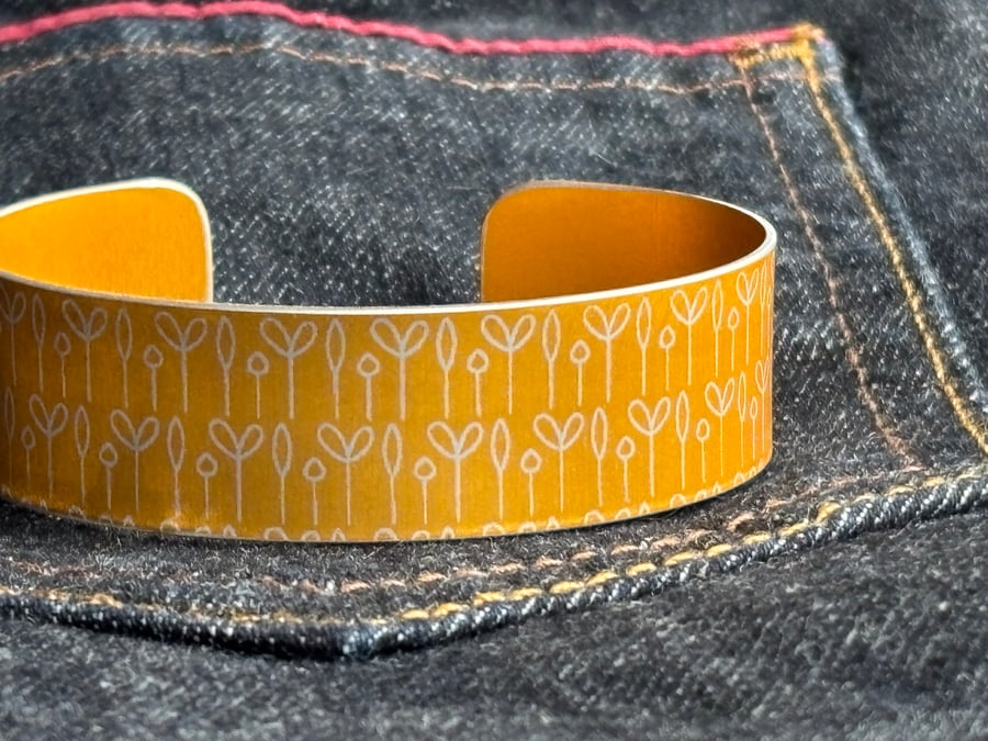 Spring buds pattern cuff bracelet orangey yellow