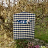 Peg bag in navy and beige check with floral lining clothes pins
