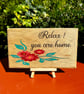 Relax. You are home wooden sign
