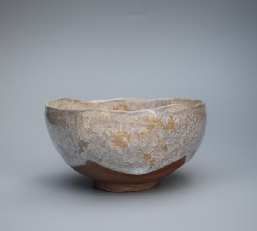 Stoneware ceramic bowl, a hand made pinch pot with a whitesilver crystalline gla