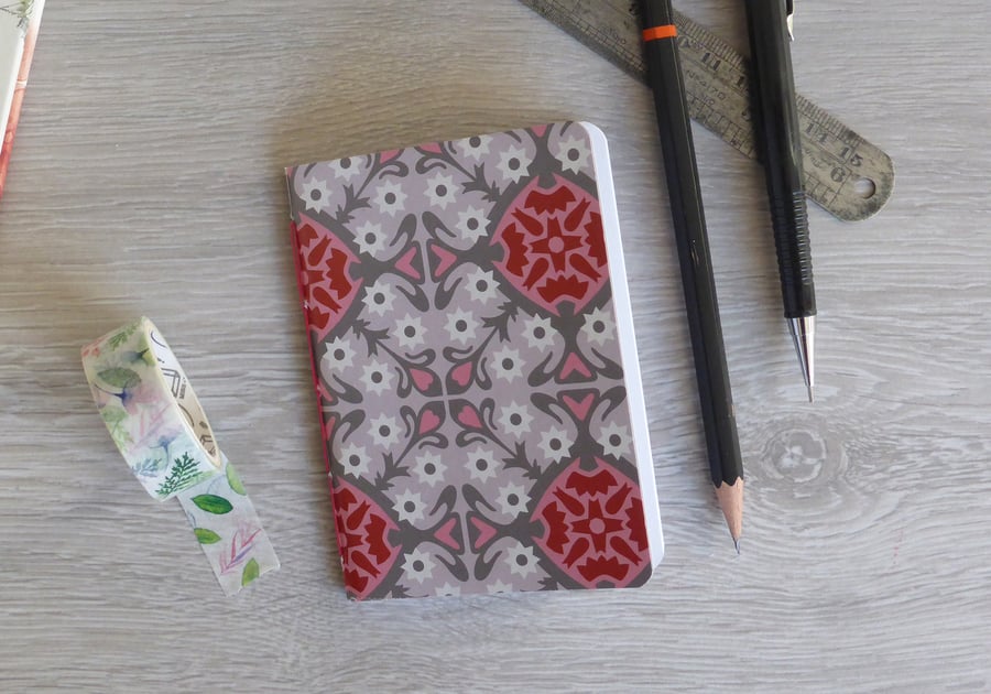 Small hand bound A7 notebook or sketchbook with grey and pink patterned cover
