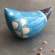 Large turquoise and dark blue ceramic bird .