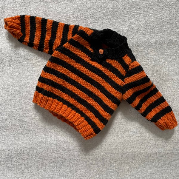 Striped jumper with neck fastening