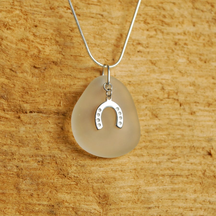 Little white beach glass pendant with horseshoe charm
