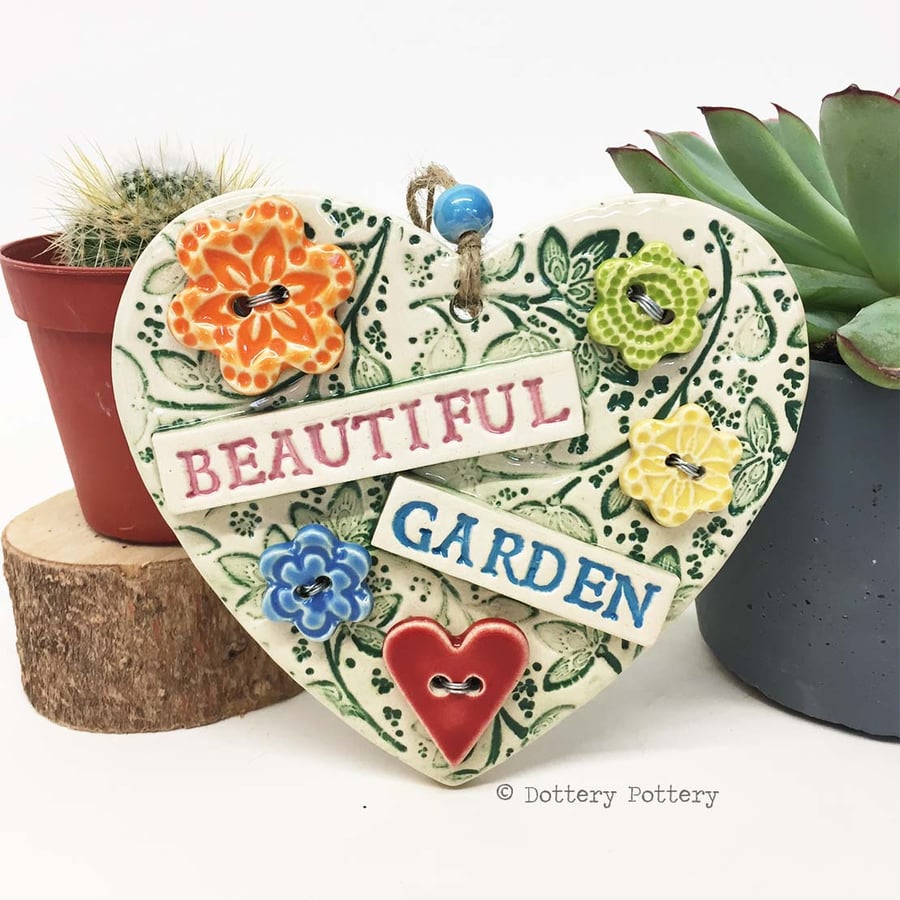 Ceramic heart decoration with button flowers Beautiful garden 