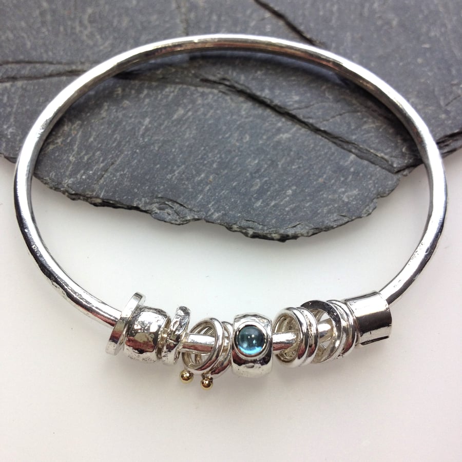 Silver blue topaz and gold bangle  No Worries Bangle