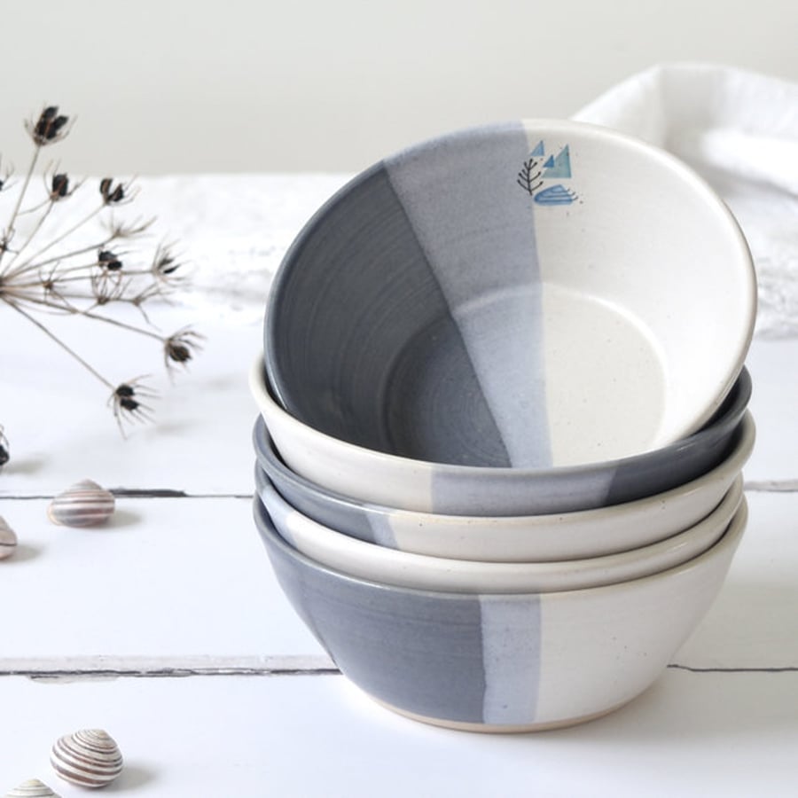 Ceramic blue and white cereal bowl with coastal illustration