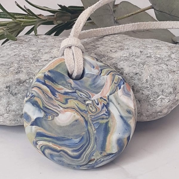 Handmade polymer clay round pendant in navy, pastel shades