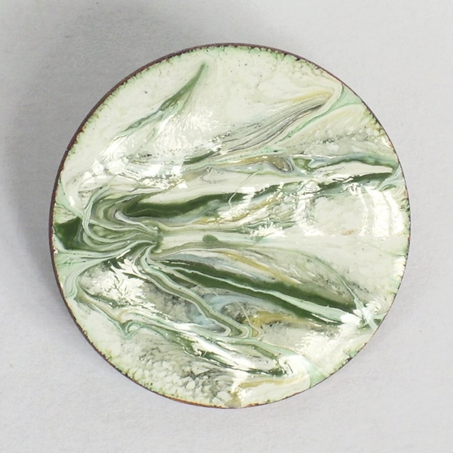 brooch - round: scrolled dark green on white enamel