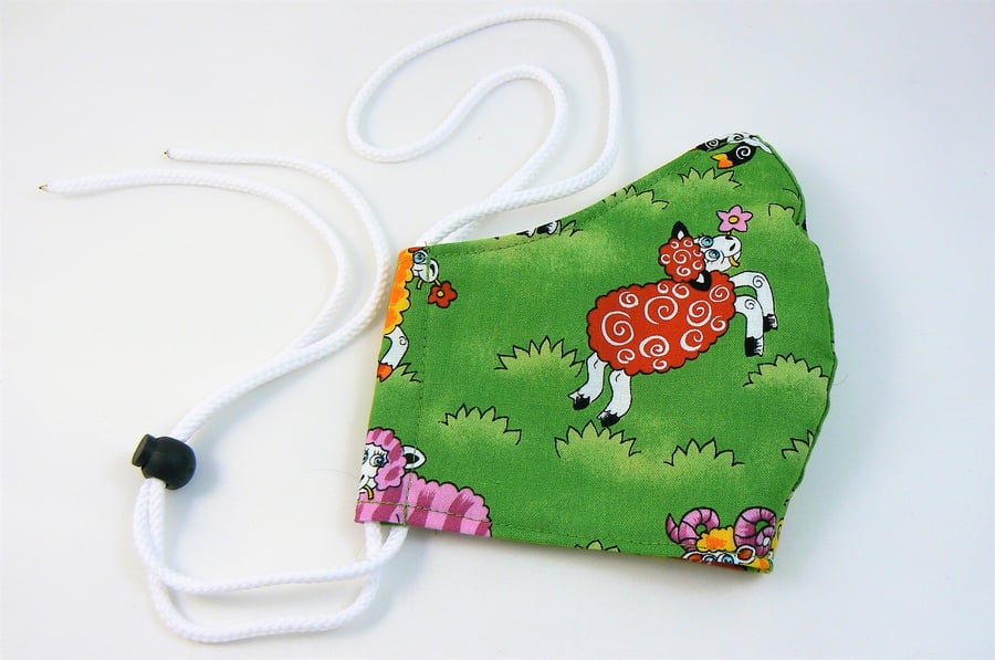 Face mask with removable nose wire , filter pocket  and drawstring toggle 