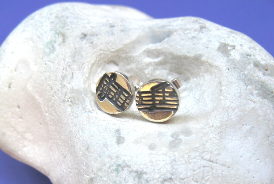 Fine silver stud earrings with musical stave