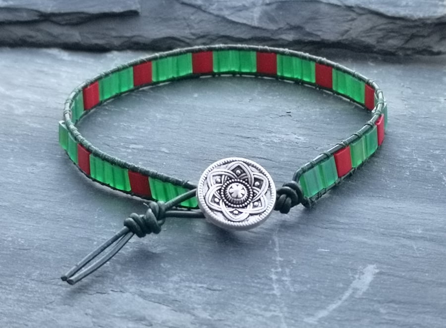 Dark green leather and red and green tile bead bracelet with decorative button 