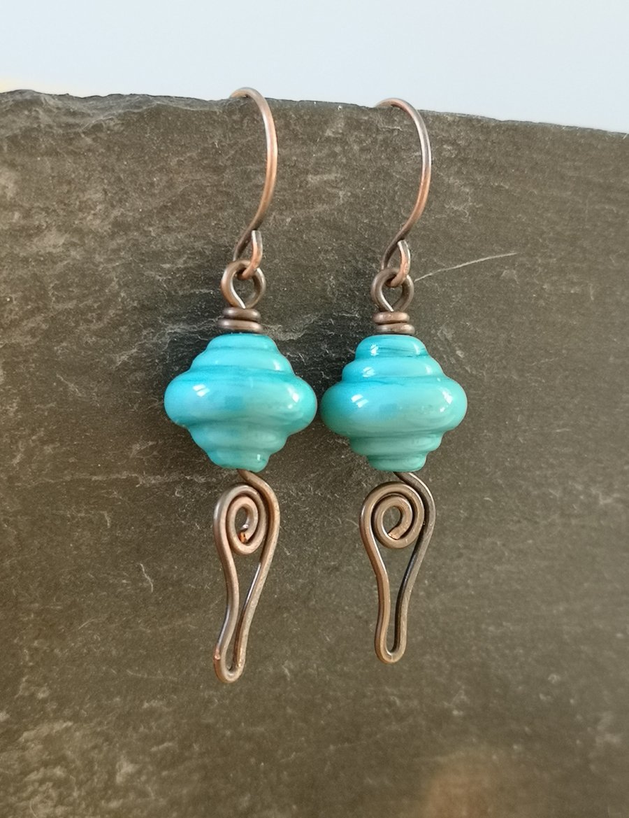 Copper earrings with teal lamp work bead and wire work