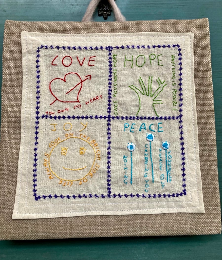 Love, hope, peace & joy embroidered picture.