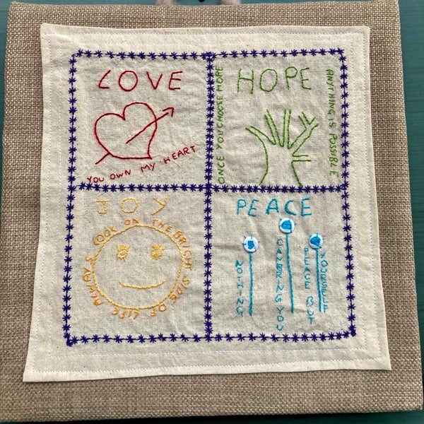 Love, hope, peace & joy embroidered picture.