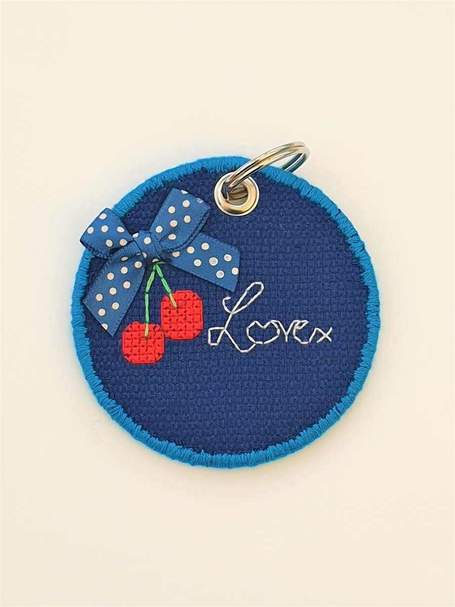 Cherry round keyring with 'Love' quote