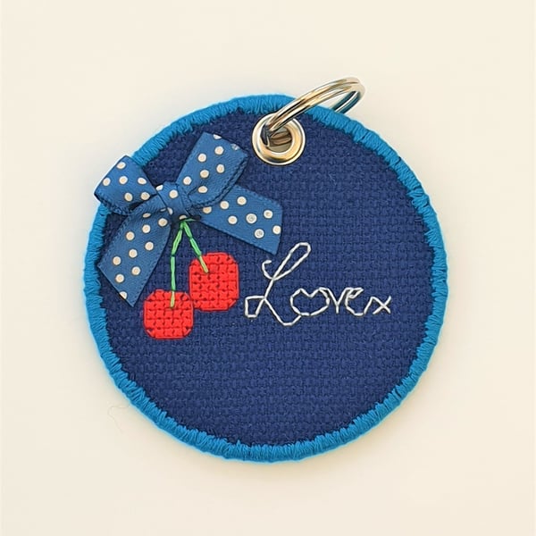 Cherry round keyring with 'Love' quote