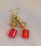 Red glass foil bead with olive, amber and gold trim