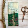 Embroidered up-cycled landscape bookmark. 
