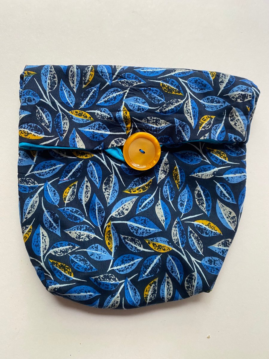 Fully lined button fastening tidy all bag.