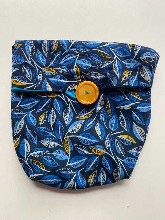 Fully lined button fastening tidy all bag.