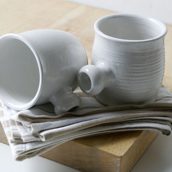 Two tulip shaped mugs - hand thrown stoneware glazed in brilliant white