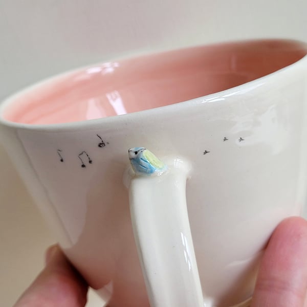 Handmade to ORDER blue tit mug with pink glaze and musical notes 