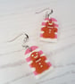 Pink and white striped gingerbread men earrings - Image 2